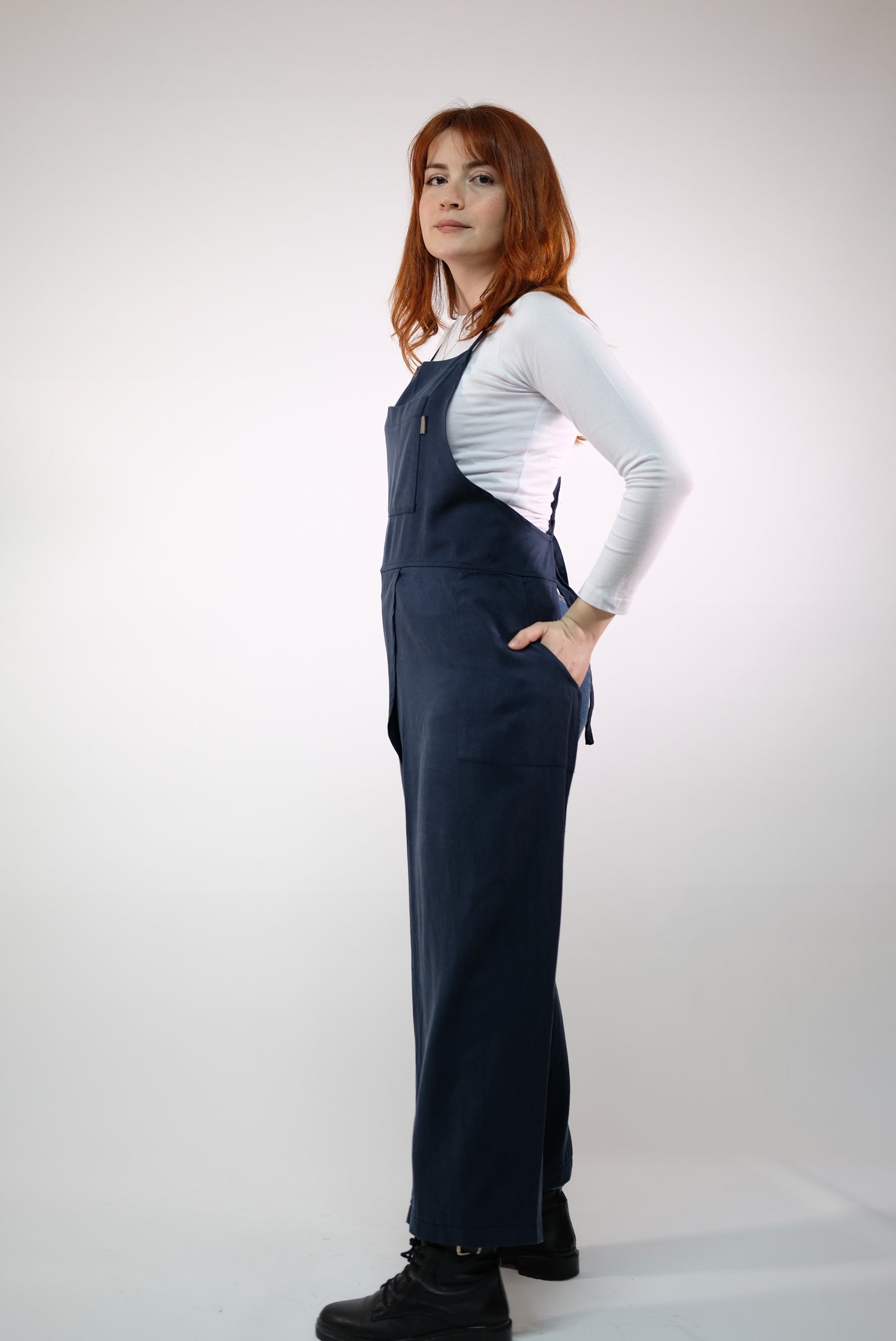 Apron laid flat, highlighting split-leg design and stitching.