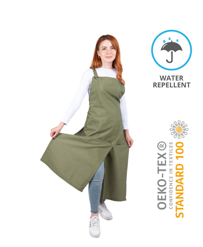 green pottery apron with cross-back ties