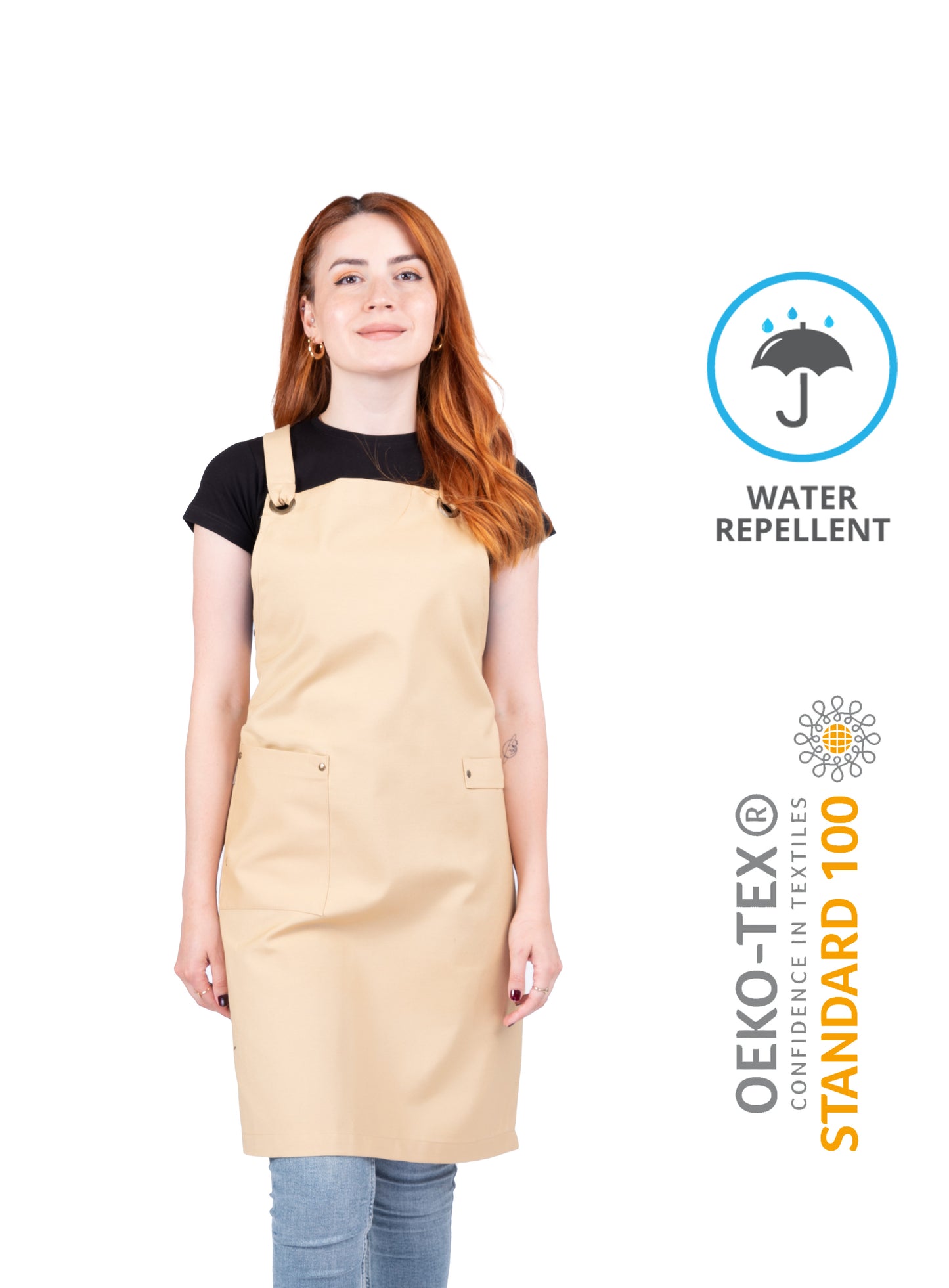 Artist wearing mustard water-repellent apron in studio.