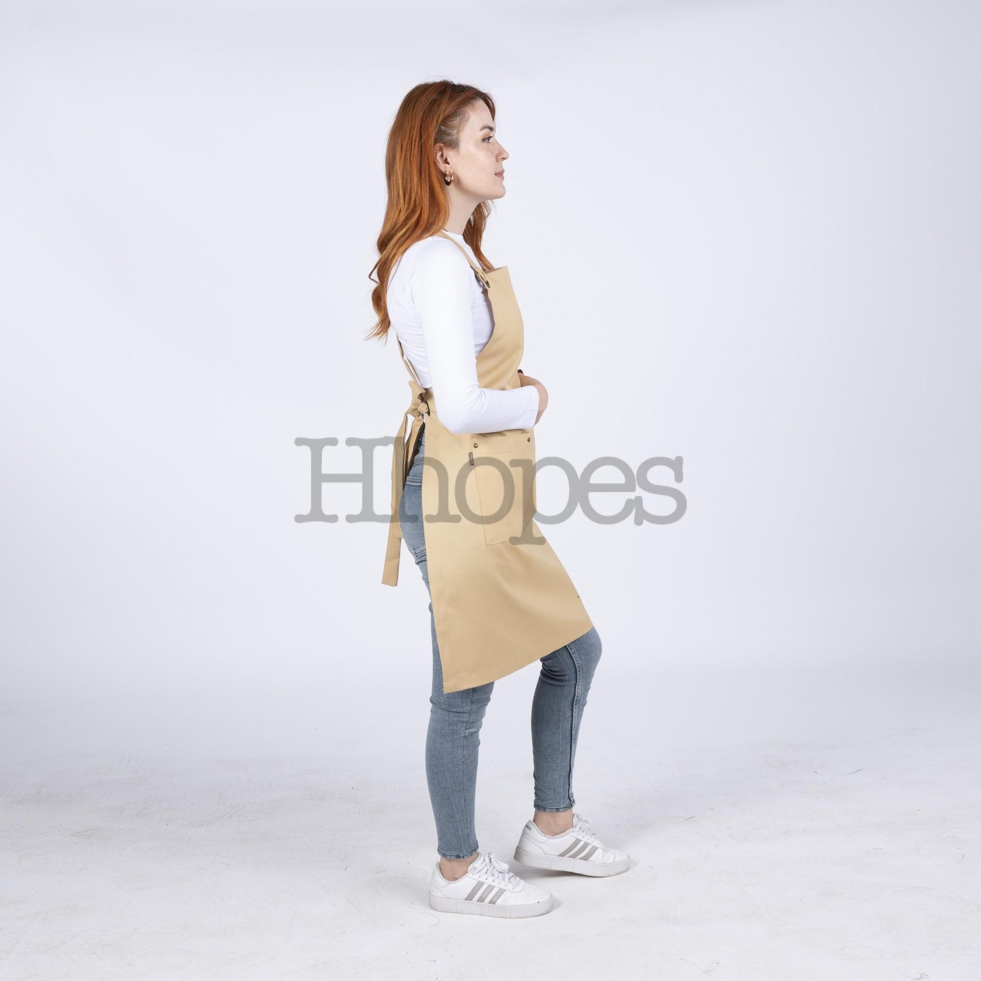  Adjustable cross-back ties shown on mustard artisan apron.