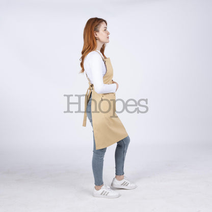  Adjustable cross-back ties shown on mustard artisan apron.