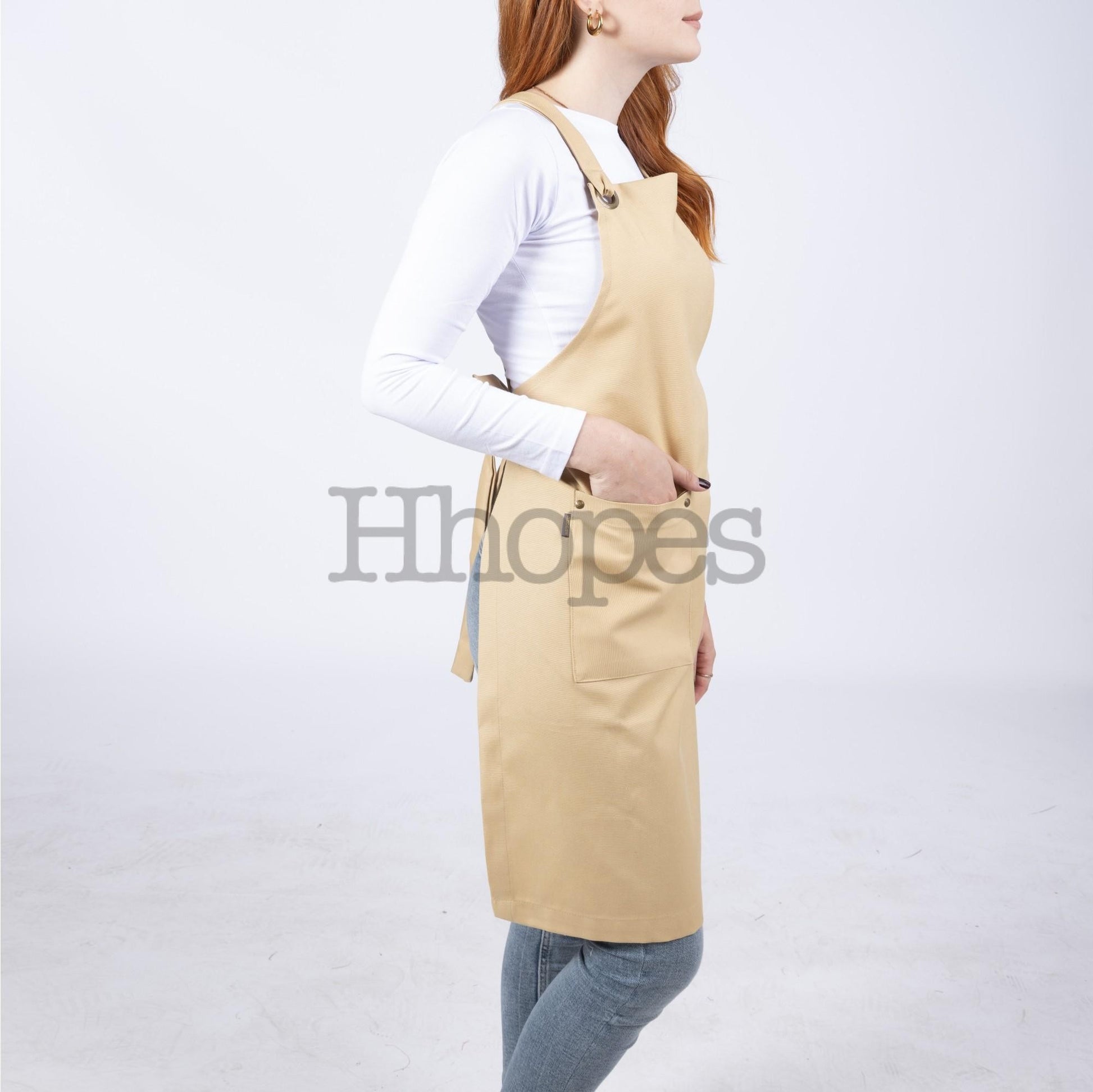 Styled photo: mustard apron next to painting tools.