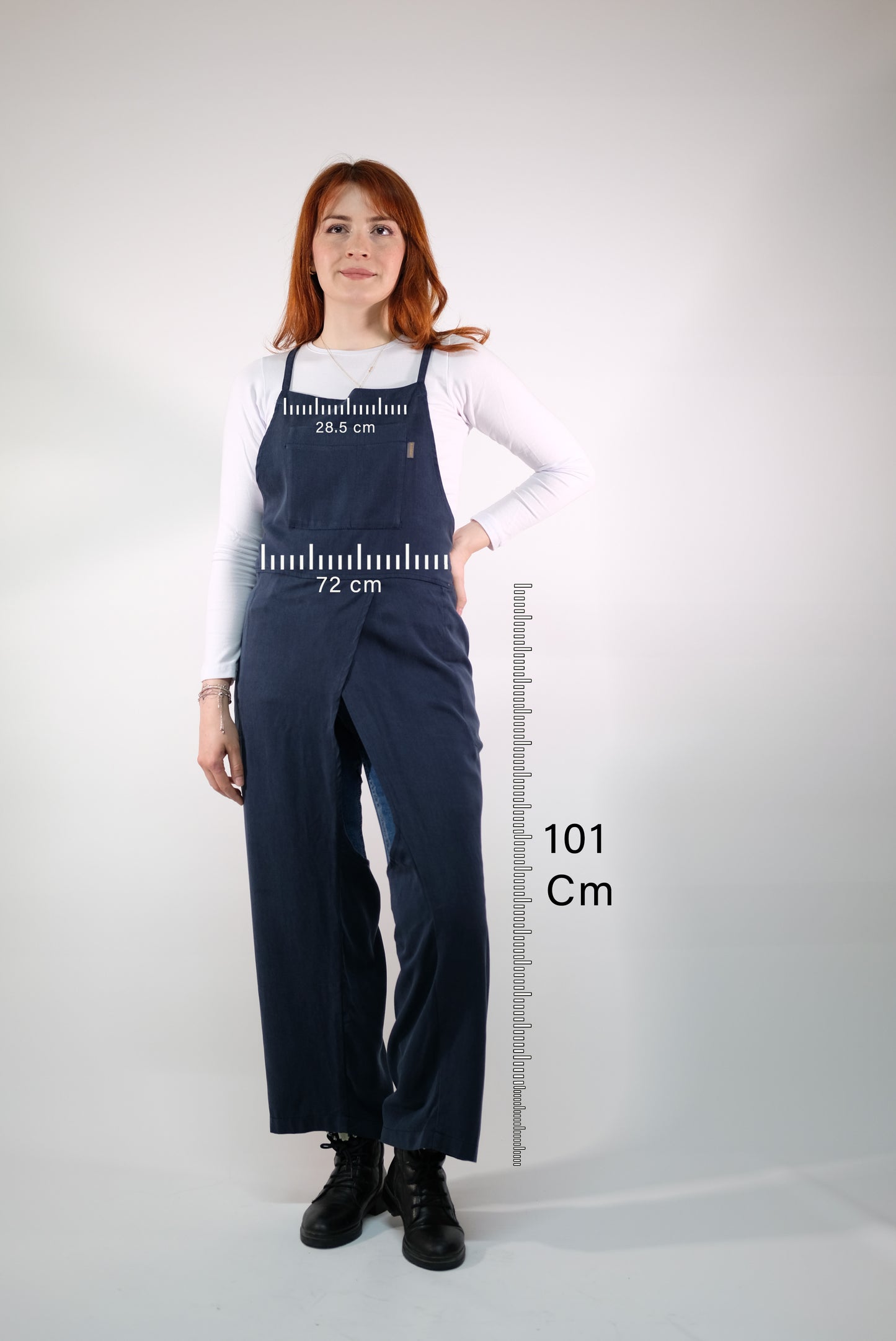 Close-up of soft, durable fabric on navy overall apron.