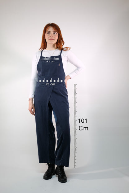 Close-up of soft, durable fabric on navy overall apron.