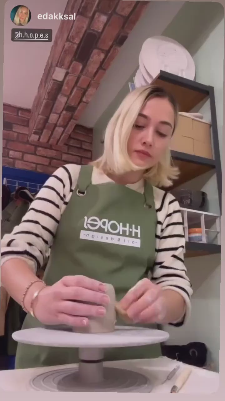 green apron with adjustable straps